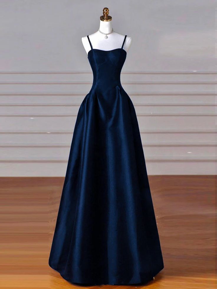 Depicting the epitome of prom night sophistication, this stunning navy blue satin gown is meticulously tailored to ensure a perfect fit. The dress's heart-shaped neckline coupled with a snug bodice highlights the wearer’s figure, while the expansive A-line skirt adds a dramatic flair perfect for the dance floor. This ensemble is carefully constructed with premium satin that gracefully drapes and swirls with every movement, capturing the essence of youthful elegance and romance. It's an ideal choice for any young woman looking to make a lasting impression at her prom. You can choose a standard size or leave us custom size, for custom size, we need the following information in the order notes when you check out :Bust: ________inch/cmWaist: ________inch/cmHips: ________inch/cmShoulder to knee Navy Blue Dress For Prom, Dark Color Prom Dress, Closed Back Prom Dress, Pretty Prom Dresses Blue, Simple Formal Dress Classy, Dark Colour Dresses, Navy Gala Dress, Midnight Blue Satin Dress, Dark Blue Dress Elegant