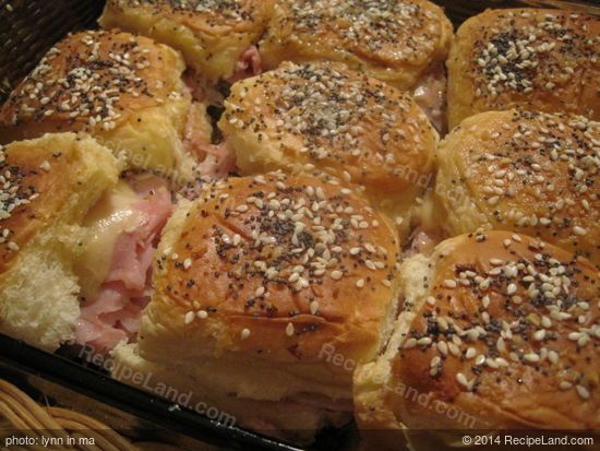 ham and cheese sliders in a basket ready to be eaten