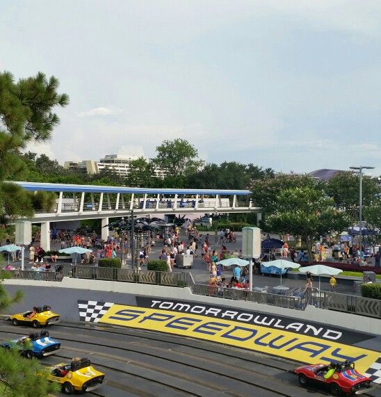 a group of cars driving around a race track