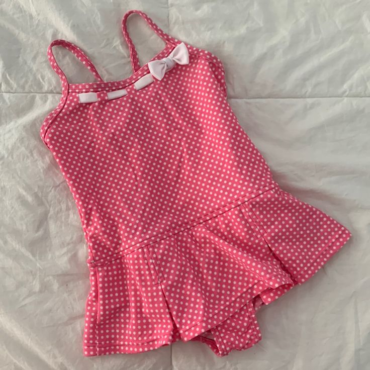 Lands’ End Skirted One-Piece Swimsuit. Pink With White Polka Dots & Ribbon Detail At Neckline. Adjustable Cross-Back Spaghetti Straps. Attached Pleated Style Skirt. Nylon/Spandex Blend. Never Worn. Nwot Skirt Bathing Suit Two Piece, One Piece Skirt Swimsuit, One Piece Swimsuit Skirt, Fitted Cotton Playful Swimwear, Playful Fitted Cotton Swimwear, Pink Cotton Swimwear For The Pool, Fitted Summer Swimwear For Playtime, Fitted Swimwear For Summer Playtime, Fitted White Swimwear For Playtime