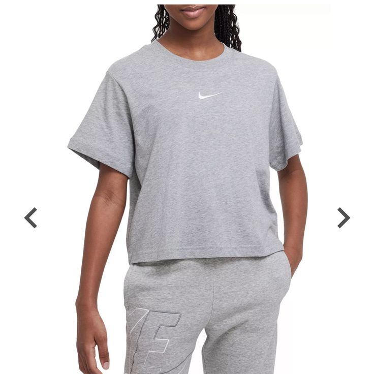 Grey New With Tags Sporty Boxy Fit Tops For Sports, Athleisure Boxy Fit Tops For Sports, Nike Graphic Print Tops For Loungewear, Nike Activewear In Athletic Heather Color, Casual Style, Nike Casual Activewear In Gray, Nike Casual Activewear In Athletic Heather, Athleisure Activewear With Logo Print And Short Sleeves, Athleisure Tops With Logo Print For Loungewear, Nike Sporty Tops