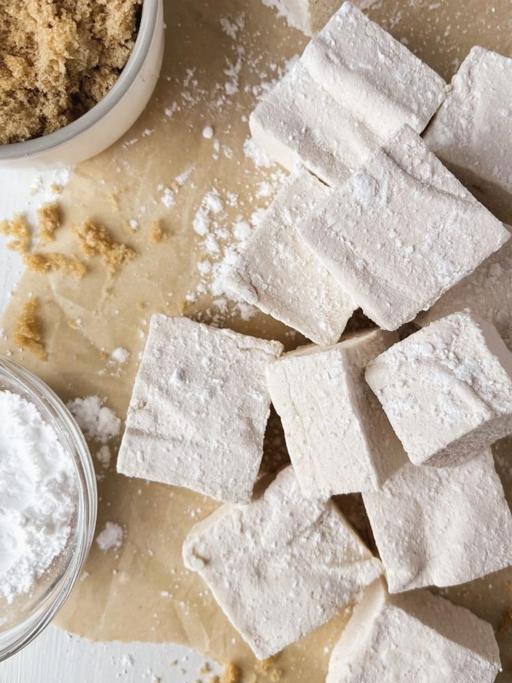 sugar cubes and powdered sugar on a table