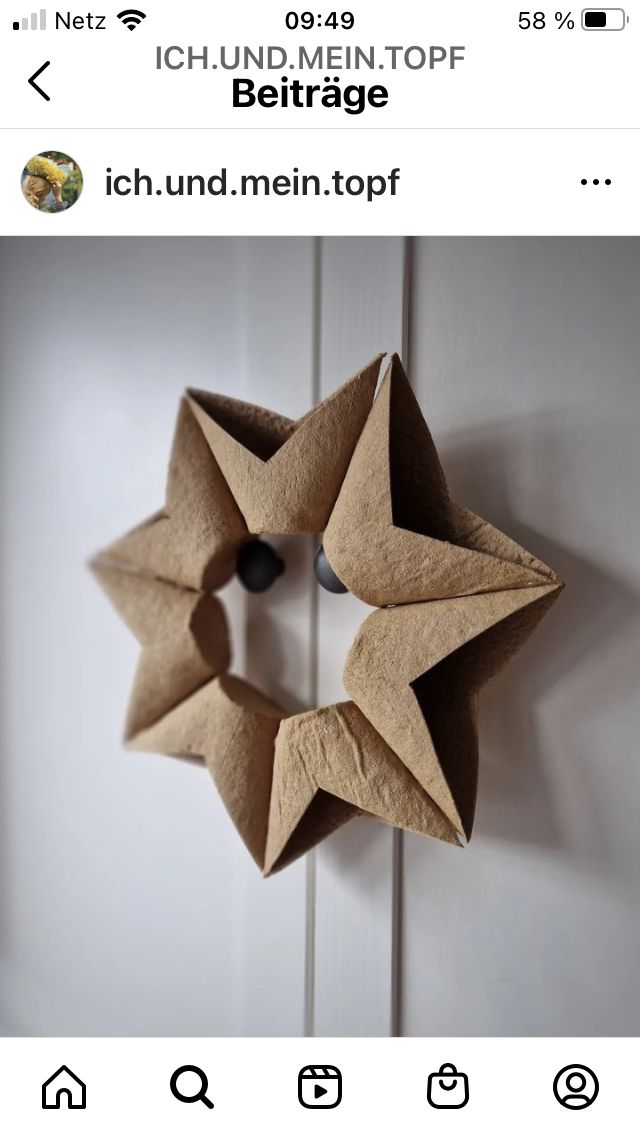 an origami star hanging on a door with the caption'i found men top '