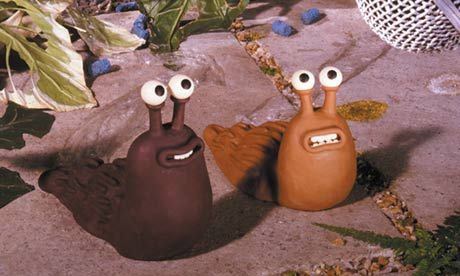 two cartoon characters sitting on the ground next to each other with eyes painted on them