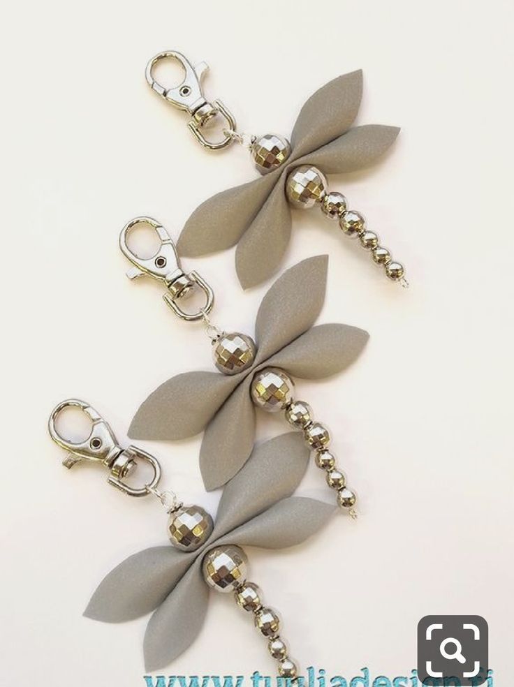 three dragonfly key chains are shown with silver beads and metal clasps on each side