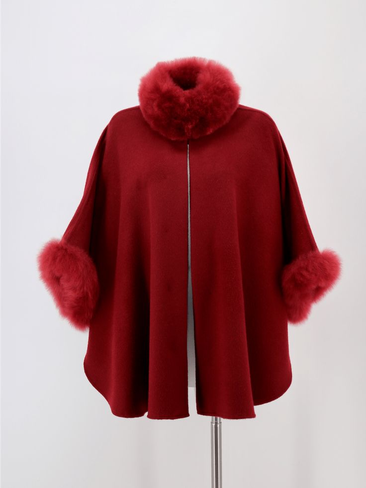 Crafted in sumptuous baby alpaca blend and lightly brushed for softness, our classic cape is an exquisite outerwear piece to complement any wardrobe. A short swing silhouette, perfect to dress up or wear with skinny jeans & boots. Product Details: 80% Baby Alpaca / 20% wool Top front button concealed Unlined Approximate length from shoulder: Short: 27 inches (ca. 69 cm) Long: 32 inches (ca. 81 cm) Dry clean only Made in Peru Elegant Alpaca Outerwear For Winter, Elegant Alpaca Outerwear For Fall, Elegant Winter Cape, Elegant Solid Winter Cape, Elegant Solid Color Winter Cape, Luxury Wool Cape For Winter, Luxury Wool Winter Cape, Elegant Cashmere Winter Cape, Luxury Winter Poncho