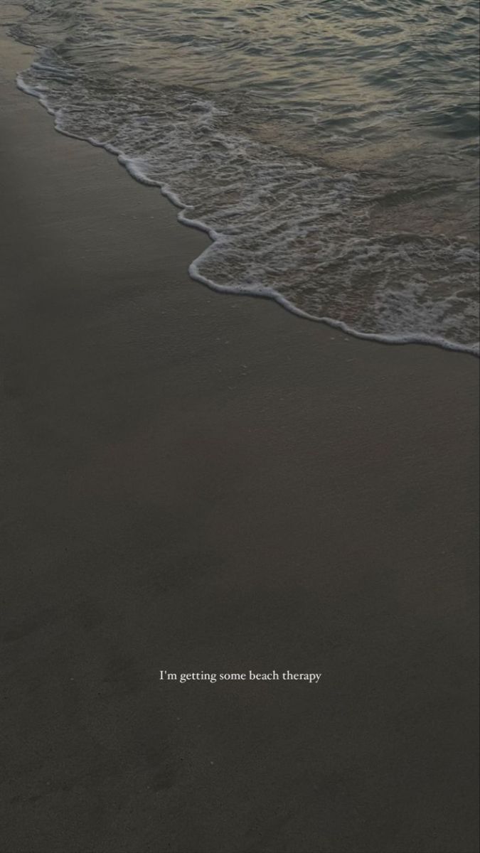 an ocean beach with waves coming in to shore and the words i'm getting some beach therapy written on it