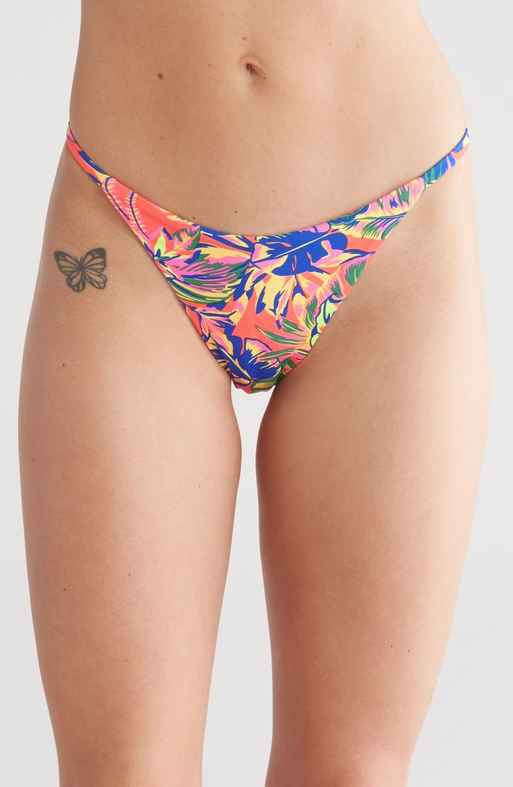 Make a splash in this vibrant reversible print bikini bottoms while you soak up the sun by the poolside. Pattern on reverse side may vary 52% regenerate polyamide, 30% polyamide, 18% spandex Hand wash, dry flat Imported Vibrant Stretch Swimwear For Beach Season, Vibrant Stretch Swimwear For Sunbathing, Multicolor Bold Print Swimwear For Sunbathing, Beachy Multicolor Bottoms For Beachwear, Beachy Multicolor Bottoms For Sunbathing, Vibrant Fitted Poolside Bottoms, Multicolor Vacation Bottoms For Sunbathing, Multicolor Bottoms For Sunbathing On Vacation, Vibrant Fitted Bottoms For Poolside