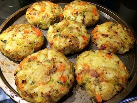 some food that is sitting on a metal pan and ready to be cooked in the oven