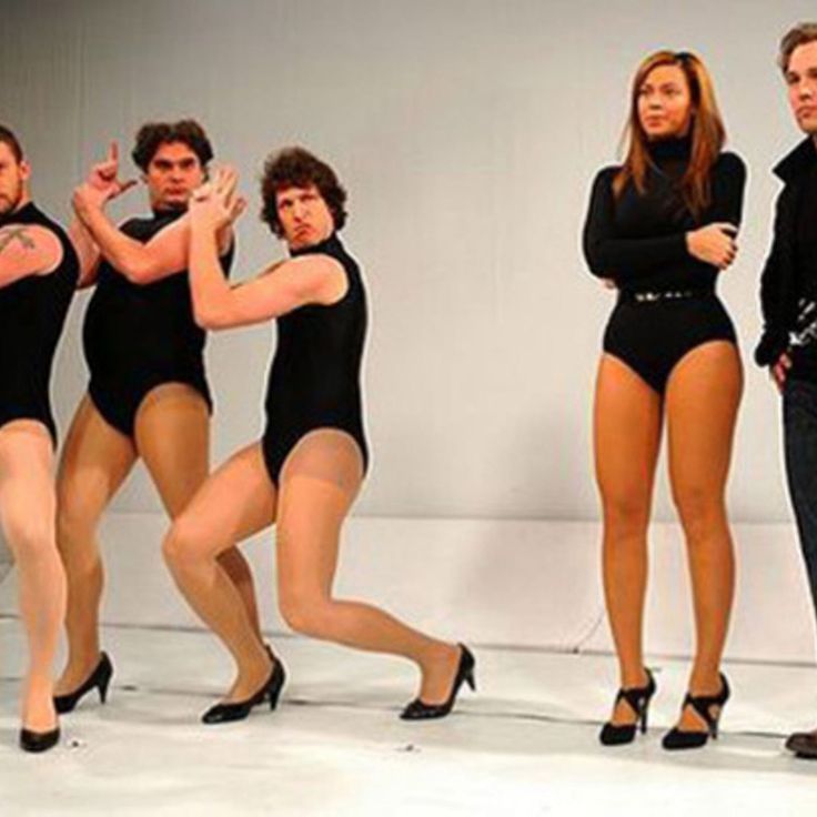 the dancers are posing in their black leotards