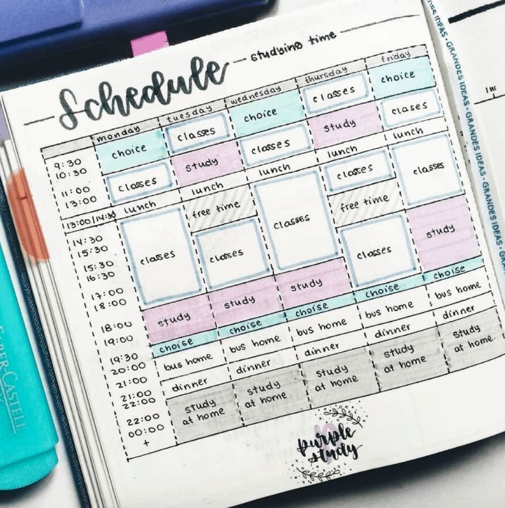 an open planner sitting on top of a table