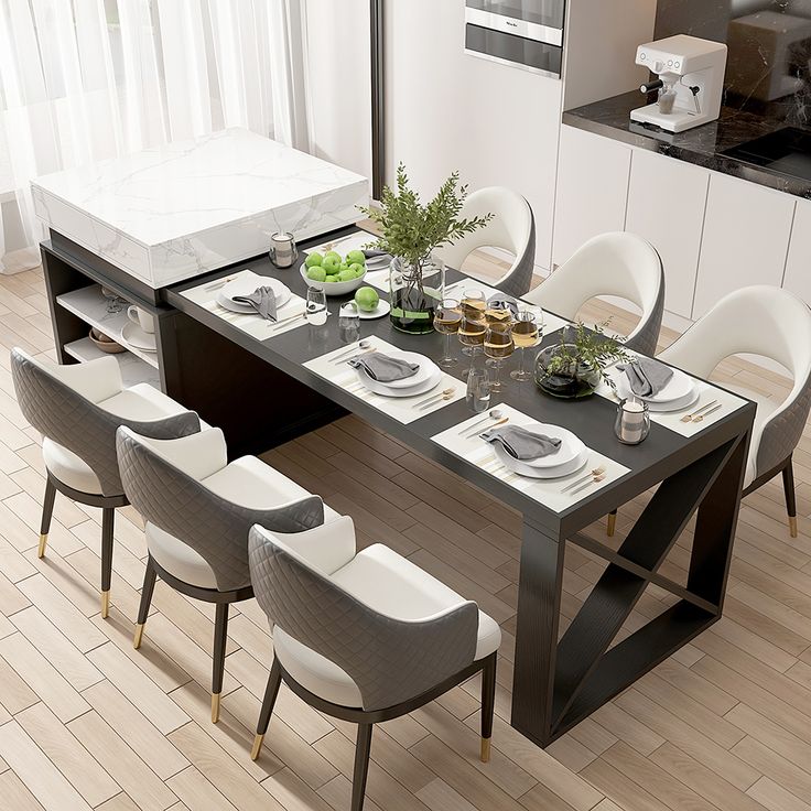 a dining room table set for six with white chairs and place settings on the table