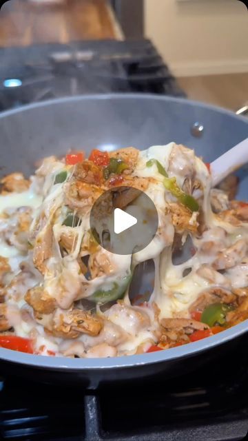 a pan filled with food on top of a stove