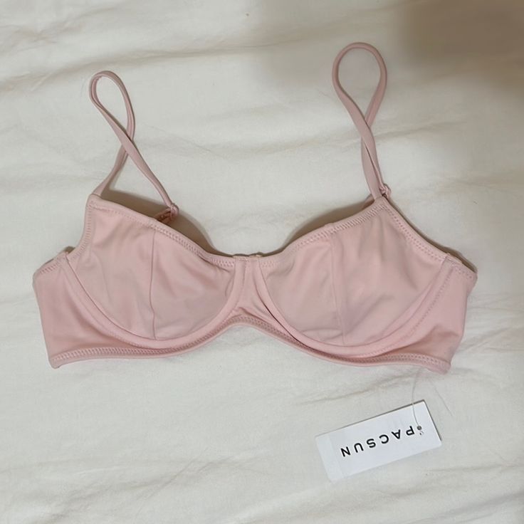 Super Cute Light Pink Bikini Top From Pacsun, New With The Tag. Very Flattering And Has Underwire, Adjustable Straps, And A Back Clasp. The Perfect Girly And Coquette Piece For Swimming! Summer Beachwear Bra With Padded Cups, Padded Swimwear For Sunbathing, Padded Bra For Sunbathing In Summer, Fitted Summer Bra With Adjustable Straps, Underwire Bra For Pool, Trendy Swimwear With Removable Bra Pads For Summer, Trendy Summer Swimwear With Removable Bra Pads, Summer Bra With Removable Pads For Sunbathing, Summer Vacation Bra With Padded Cups