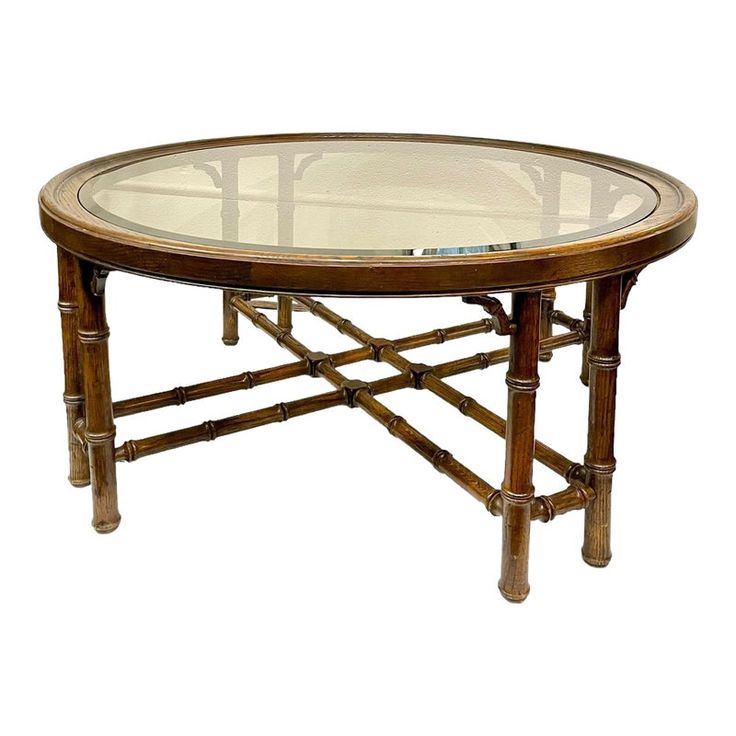 a table with glass top and bamboo legs