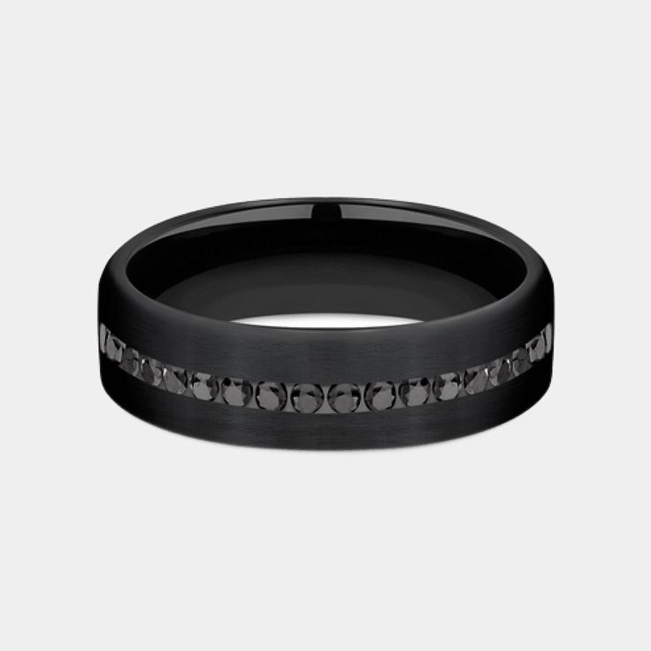 Introducing the Edison, a masterpiece of modern jewelry design that marries the sleek, enduring appeal of black titanium with the opulent brilliance of black diamonds. This 6.5mm comfort fit wedding band is a symphony of sophistication and strength, featuring a satin finish on black titanium that serves as the perfect backdrop for the twenty channel-set black diamonds. With a total carat weight of .40ct, these diamonds sparkle with a mysterious allure, making the Edison not just a ring, but a st Elegant Titanium Wedding Rings, Elegant Tungsten Carbide Wedding Jewelry, Elegant Black Bands For Anniversary, Elegant Black Anniversary Bands, Elegant Tungsten Carbide Wedding Rings, Elegant Wedding Rings In Tungsten Carbide, Classic Black Diamond Promise Ring, Modern Black Diamond Promise Ring, Black Diamond Wedding Ring With Round Band