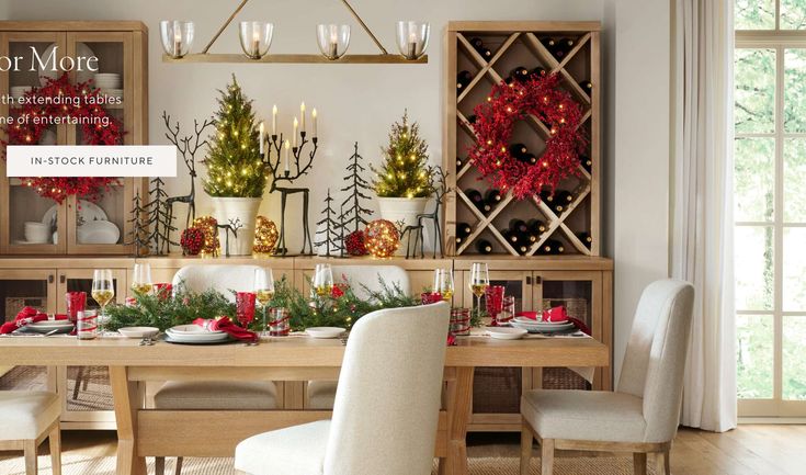 a dining room table decorated for christmas with holiday decorations