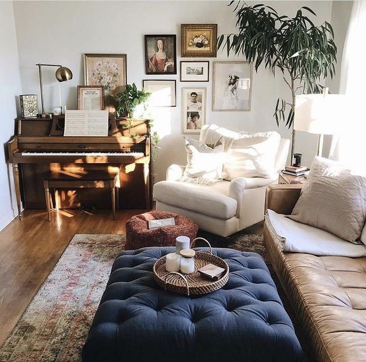 a living room filled with furniture and a piano