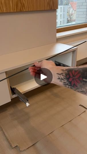 a man is working on an unfinished desk