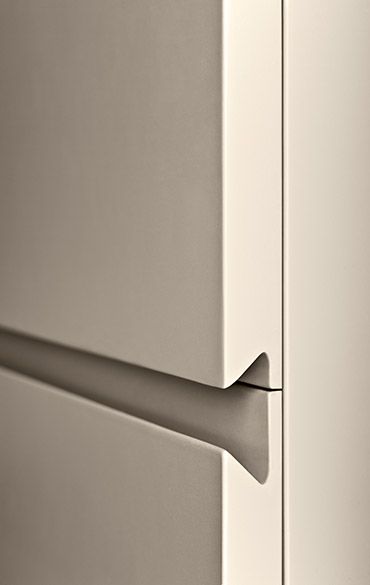 a white refrigerator with a handle on it's door