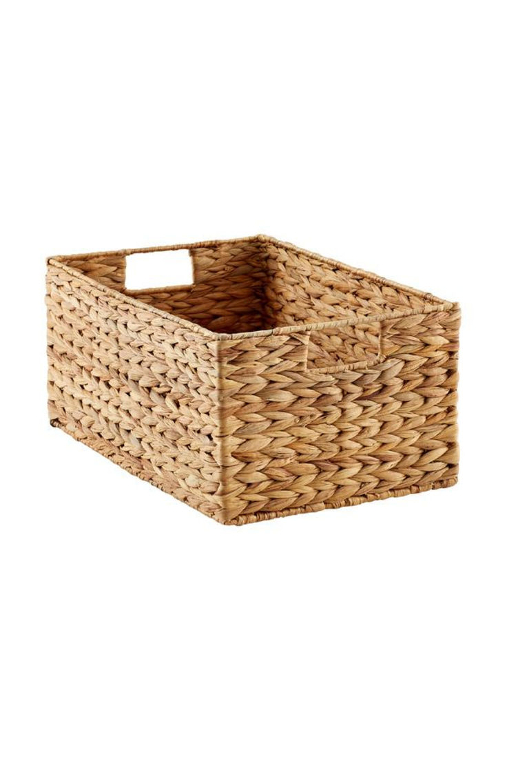 an empty wicker basket on a white background