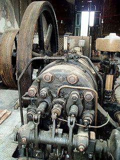 an old steam engine sitting in a garage