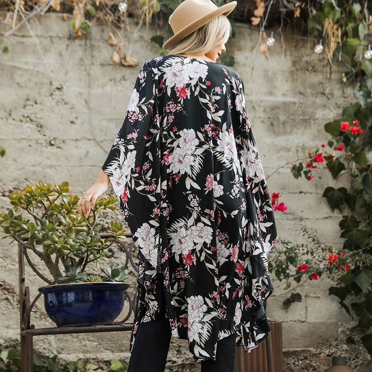 Flutter into fashion with our Floral Butterfly Sleeve Kimono! Featuring a beautiful butterfly print and flowy sleeves, this kimono is the perfect addition to any outfit. Soar with style and embrace your inner free spirit. Casual Black V-neck Kimono, Black Long Kimono For Beach Cover-up, Chic Black V-neck Kimono, Black Spring Kimono For Day Out, Black Kimono For Spring Day Out, Black Kimono For A Spring Day Out, Flowy V-neck Kimono For Day Out, Chic Fall Kimono For Day Out, Casual Black Kimono With Relaxed Fit