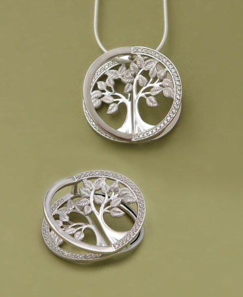 You’ll do a double take with this pendant’s exquisite architecture. Its multiple layers create stunning depth and dimension while crystal inlays round out the piece with a sparkling border. Look at it head on and the tree appears to pop! The Tree of Life represents harmony and interconnectedness: its border shows we are all linked together in the great circle of life. Made of sterling silver, this pendant measures 1 inch wide and 1 inch long. Tree of Life sparkling pendant Unique three-dimension Transformable Jewellery, Silver Earrings Outfit, Baguette Diamond Necklace, Fan Jewelry, Buddha Jewelry, Infinity Jewelry, Love And Care, Sterling Pendant, The Tree Of Life