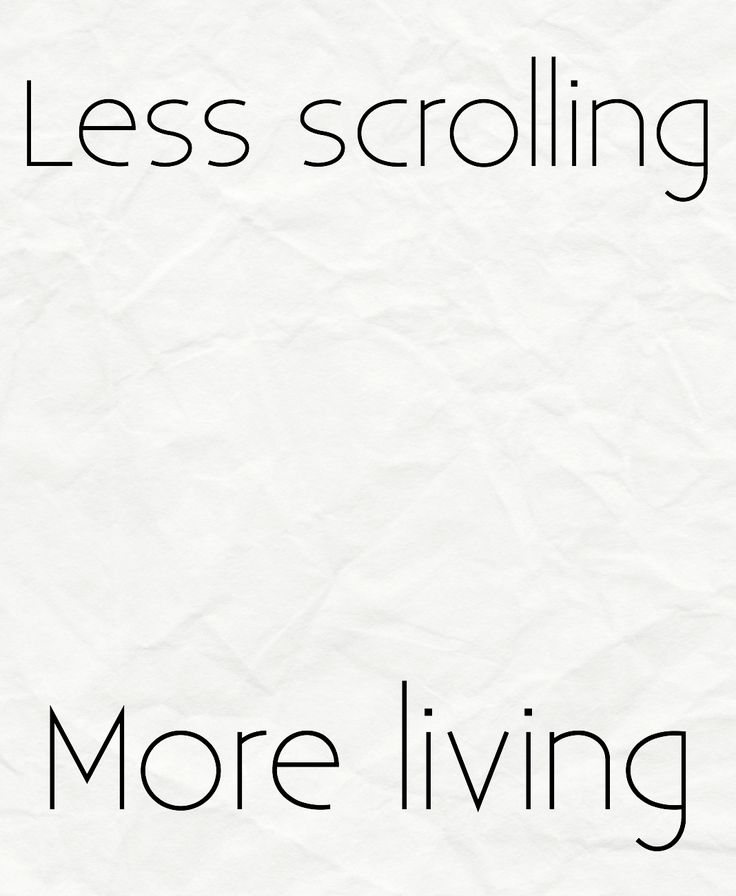 the words less scrolling and more living are written in black ink on white paper,