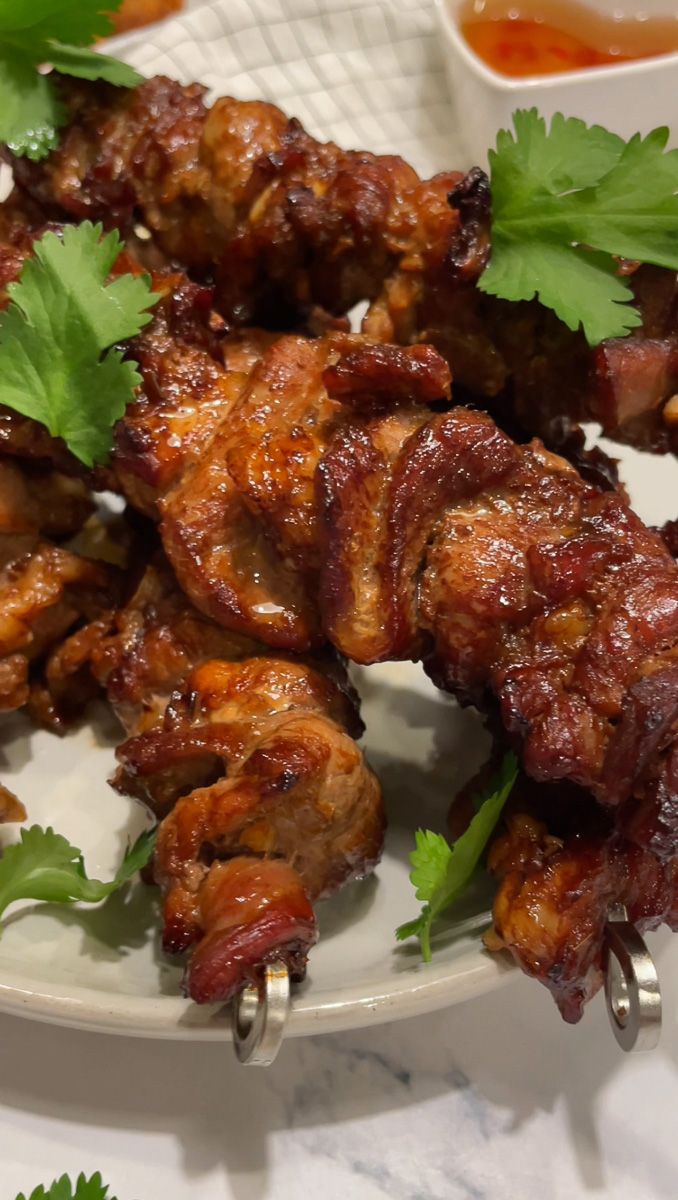 chicken wings with cilantro garnish on a plate