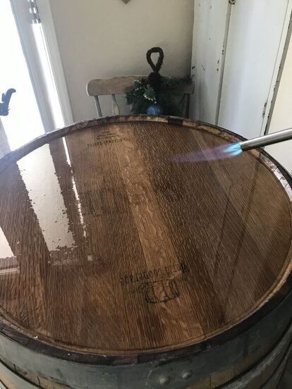 an old wooden barrel sitting on top of a table