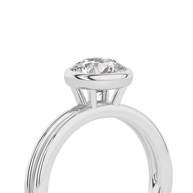 Crafted with exquisite detail, this Coupled Round Bezel Ring features a brilliant round lab-grown diamond nestled within a unique dual-band design. One band gleams in lustrous white gold, while the other elegantly contrasts in either romantic rose gold or striking yellow gold. All white gold option is also available. This solitaire diamond ring perfectly blends contemporary sophistication and classic charm, making it an ideal choice for engagements, anniversaries, or simply as a symbol of enduri 14k White Gold Diamond Ring With Tension Setting, Solitaire White Gold Halo Ring With Round Cut, Classic Halo Ring For Promise, Round Cut, Classic Round Cut Halo Ring For Promise, Diamond Solitaire Halo Ring, Classic Round Cut Halo Promise Ring, Classic Round Halo Ring With Lab Grown Diamond, Refined Round Solitaire Diamond Ring, Modern Moissanite Round Cut Wedding Ring