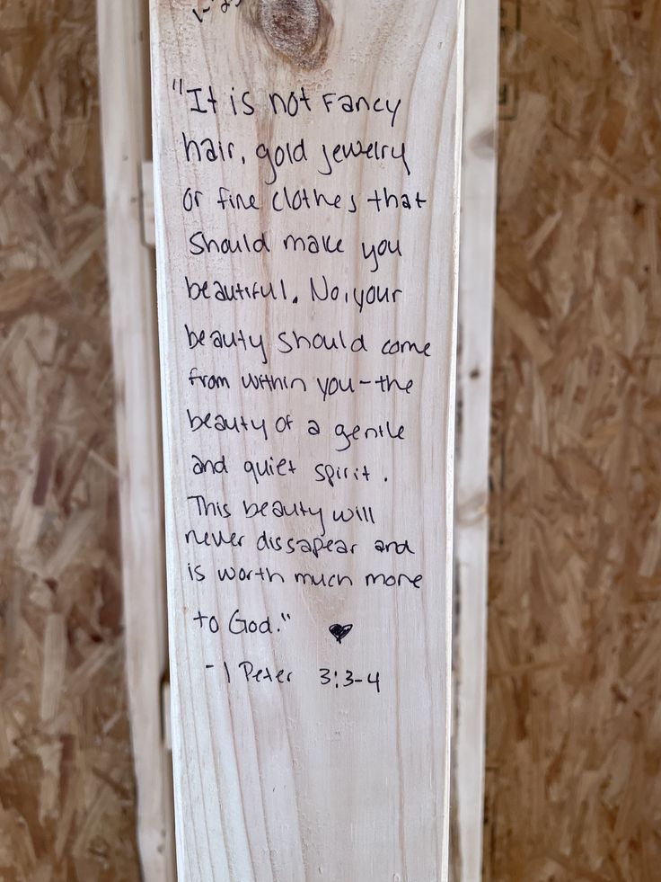 a wooden plaque with a poem written on it