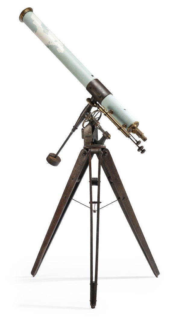 an old telescope is sitting on a tripod