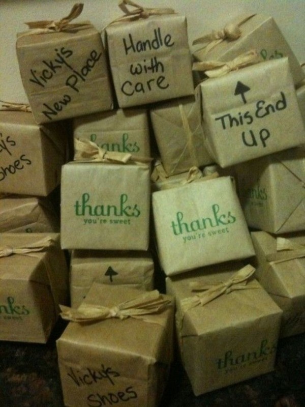 there are many boxes that say thanks and have been wrapped in twine with ribbons