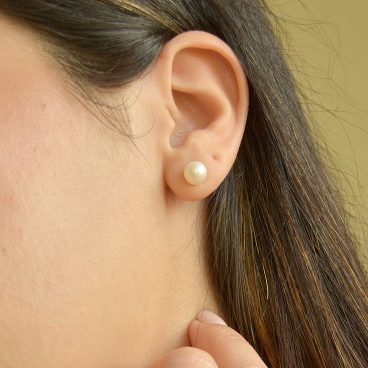 Experience the elegance and delicacy of our beautiful Pearl Stud Earrings. Each earring is crafted with Natural Freshwater Pearls and set on 14k gold plated sterling silver, making them perfect for sensitive skin. The versatile style adds a classic and elegant touch to any occasion, and they are particularly ideal for a bride on her wedding day. Handmade in the U.S.A Sold in pairDETAILSWater Resistant- skin-friendly-Tarnish-free Material: Sterling Silver, 14k gold plated Natural freshwater pearl Bridal Earrings Gold, Earrings Gold Pearl, Gold Bridal Earrings, Earrings Bridesmaid, Gold Pearl Earrings, Pearl Stud Earrings, Gold Filled Jewelry, Pearl Studs, Bridesmaid Jewelry