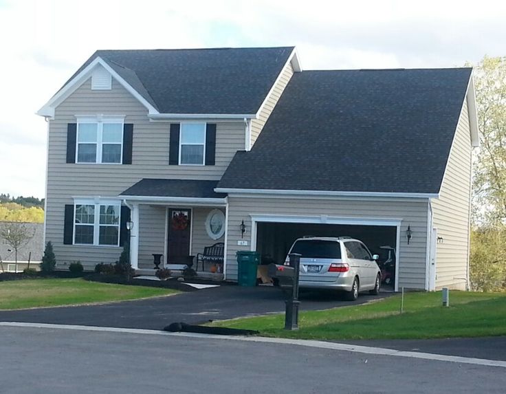 a car is parked in front of a house