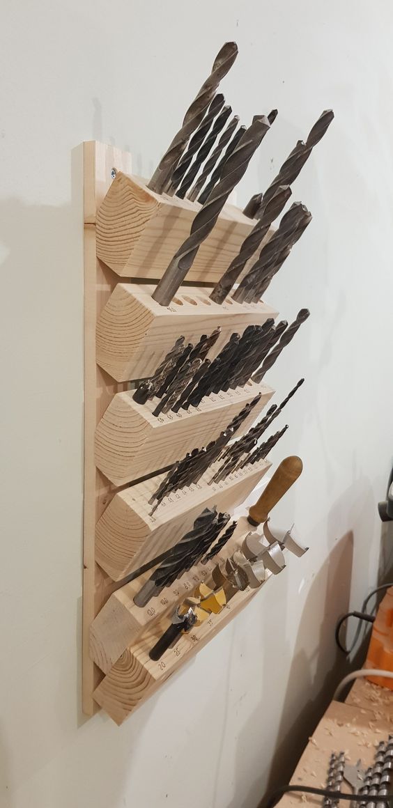 a wooden rack with many different tools on it