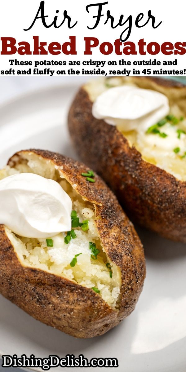 baked potatoes with sour cream and chives on the inside are ready to be eaten