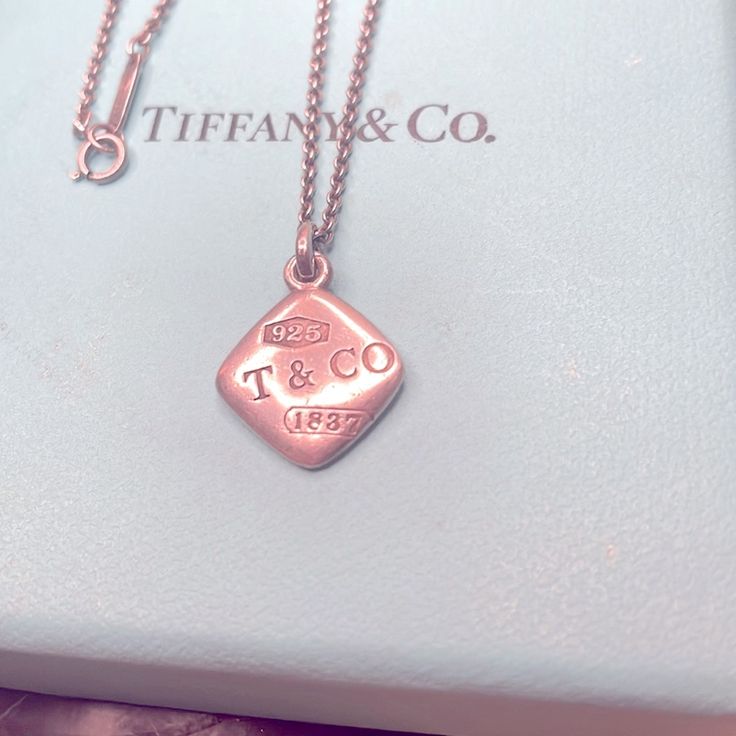 This Is An Authentic Tiffany & Co. 925 Silver 1837 Square Pendant 16” Necklace. Engraving On The Square Pendant: "925 T&Co 1837". Tiffany & Co. Pouch Included. *I’m Flexible On The Price, Please Feel Free To Make An Offer. Luxury White Gold Necklace With Hallmarks, Luxury Silver Necklace With Hallmarks, Luxury Rose Gold Jewelry With Hallmarks, Elegant Tan Jewelry For Formal Occasions, Luxury Sterling Silver Necklace With Vs Clarity, Elegant Sterling Silver Tan Necklace, Elegant Tan Sterling Silver Necklace, Elegant Tan Engraved Jewelry, Luxury Stamped 925 Necklace As A Gift