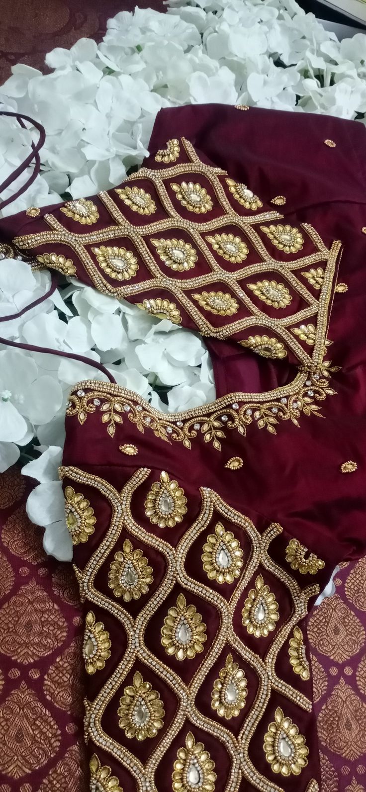 A maroon blouse worked with aari materials....neckline and full sleeve work Aari Motif, Peacock Embroidery Designs, Peacock Embroidery, Aari Design, Lehenga Saree Design, Maggam Work Designs, Aari Designs, Best Blouse Designs, Aari Blouse