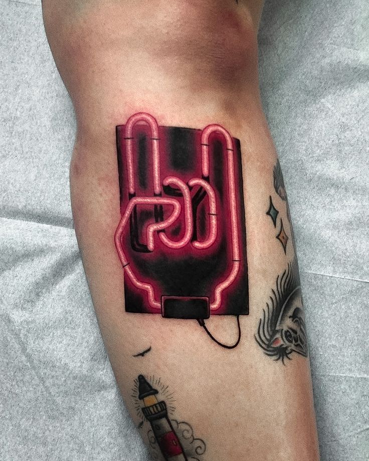 a man's leg with a neon sign on it and the word css