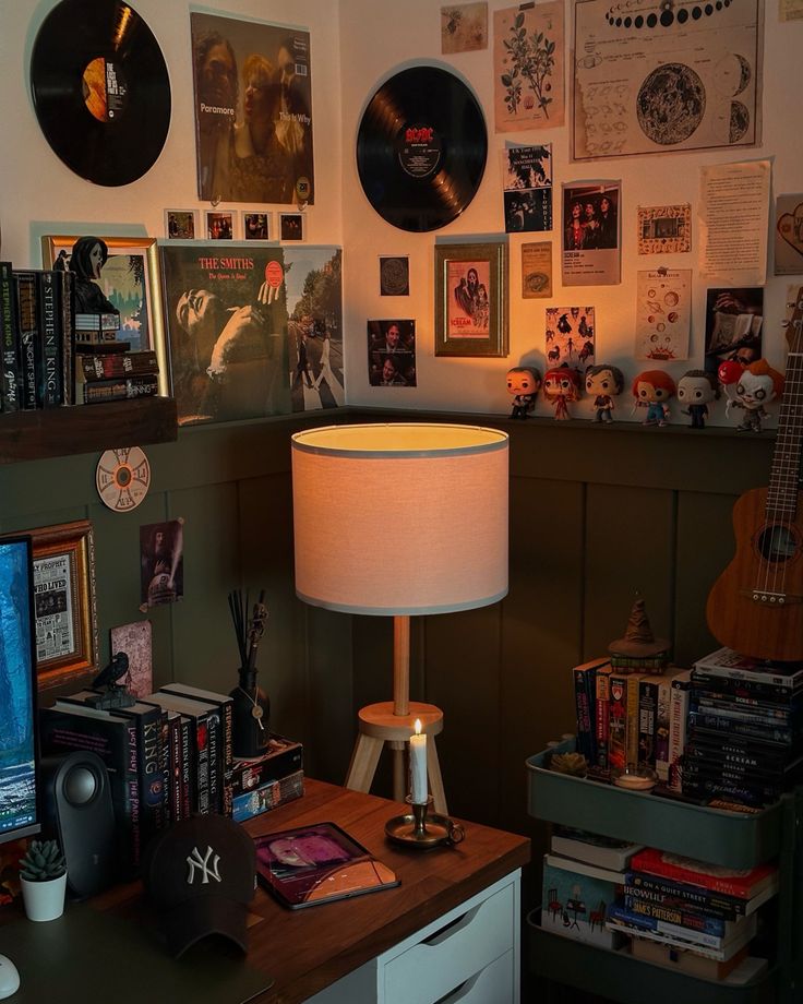 a room filled with lots of records on the wall and a lamp next to it