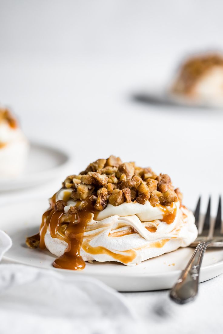 a white plate topped with dessert covered in caramel