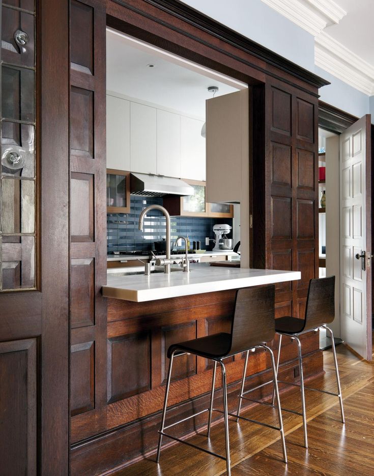 an image of a kitchen setting with bar stools