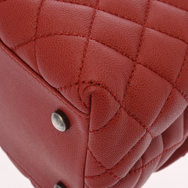 Introducing the Chanel Matrasse Top Handle 29 2Way Red Hand Bag, a timeless piece that effortlessly combines elegance and functionality. Crafted from high-quality red leather and featuring the iconic matrasse stitching, this bag exudes luxury and sophistication. The versatile design allows you to carry it by the top handle for a chic look or use the detachable strap for a more casual vibe.The spacious interior of the Chanel Matrasse Hand Bag provides ample room for all your essentials, making it Timeless Red Bag For Everyday Use, Timeless Red Satchel For Everyday Use, Red Timeless Satchel For Everyday Use, Timeless Red Satchel, Classic Red Top Handle Shoulder Bag, Classic Red Shoulder Bag With Detachable Handle, Timeless Red Leather Satchel, Timeless Red Leather Bag, Red Top Handle Business Bag