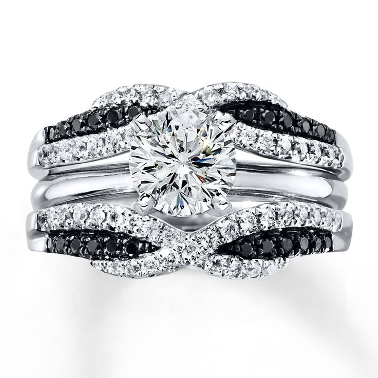 an engagement ring set with black and white diamonds