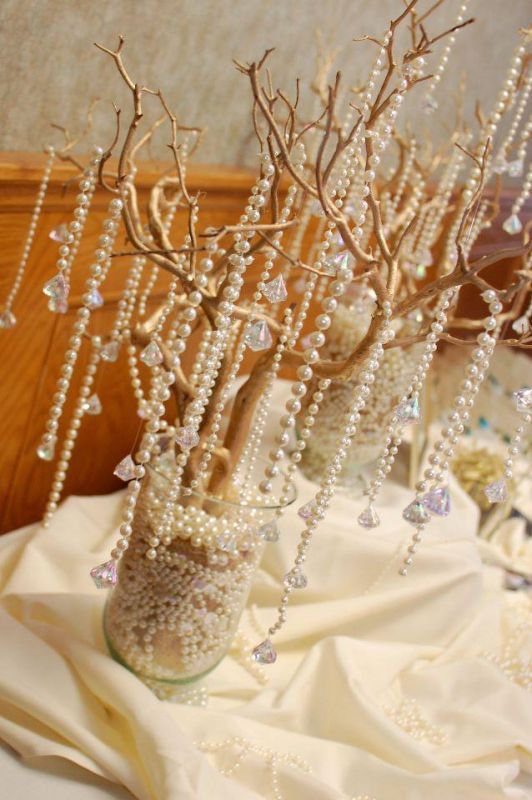 wedding centerpieces with pearls and tree branches