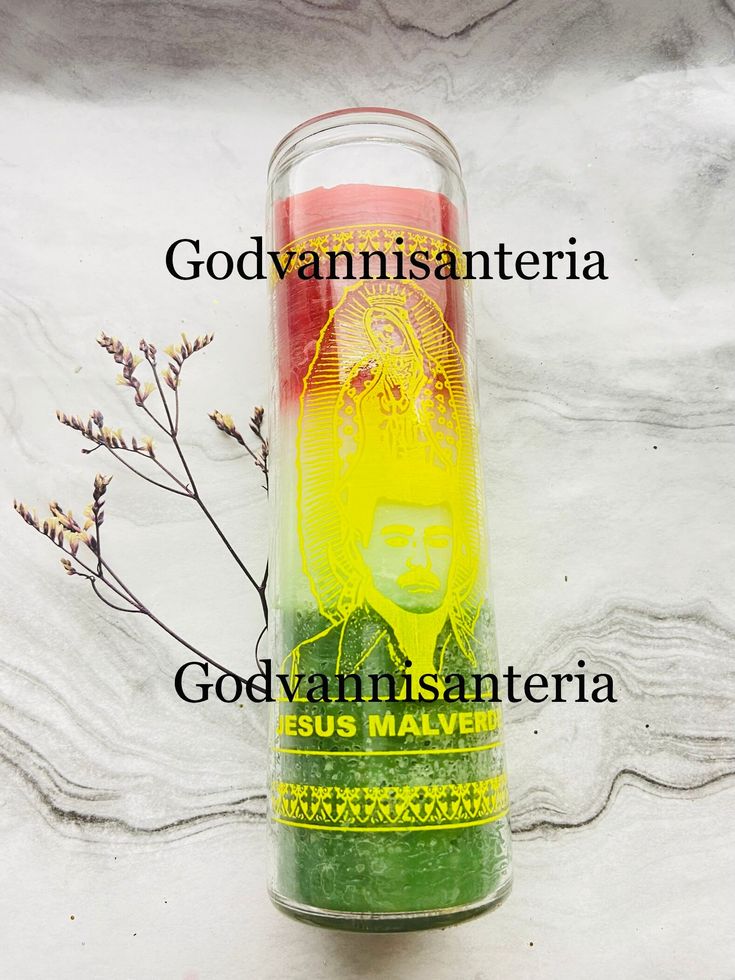 a candle with the words godvaninsanteria and jesus maven on it