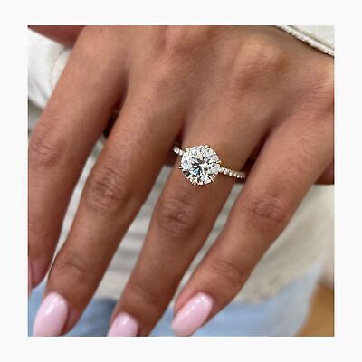 a woman's hand with a diamond ring on it